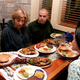 Family members try in vain to avert their eyes from the crackling plate of chicken and vegetables.